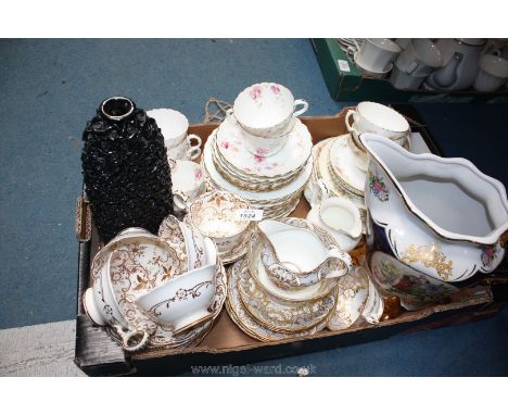 A quantity of china including plates, saucers, cups, bowls, milk jug and vase, etc.