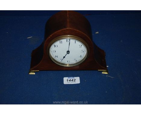 A small Napoleon style French Clock having four brass feet