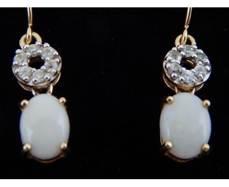 A pair of 9ct yellow gold, diamond and opal drop earrings. 