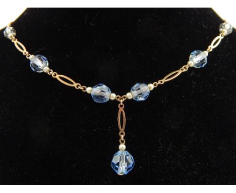 A 9ct yellow gold and pearl and blue topaz beaded necklace. 