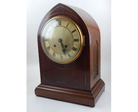 An early 20th century mahogany lancet shaped bracket clock, the enamel dial with Roman numerals and outer minute track, eight