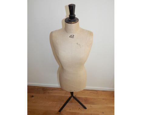 A 20th century tailor's mannequin, the torso upholstered in cream calico. H. 150cm