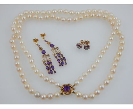 A double strand pearl necklace, set with 9ct yellow gold and amethyst clasp, together with a pair of yellow metal and amethys