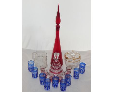 A late 19th century flash-cut cranberry and clear glass decanter, of tapering conical form, with six glasses, together with n