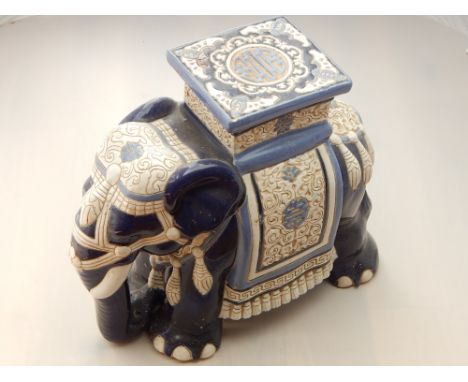 A ceramic plant stand in the form of an elephant. H. 43cm