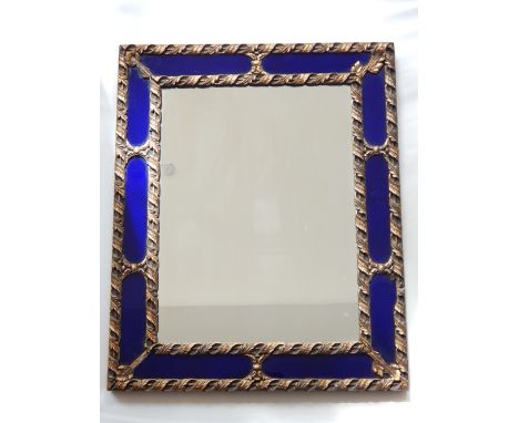 A rectangular wall mirror, the plate within a gesso frame and blue margin plates, W. 54cm.