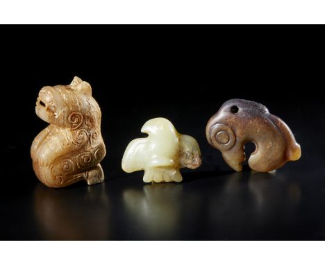 Chinese Art Three jade carvingsChina, Neolithic period. . Cm 2,00 x 5,50. Lot consisting of three jade carvings of different 