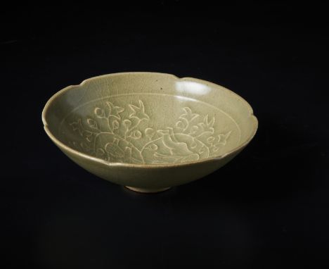 Chinese Art A celadon glazed pottery Yaozhou bowl China, 20th century. . Cm 14,90 x 5,20. Moulded decorated with children at 
