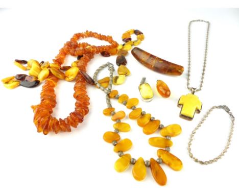Collection of vintage amber jewellery comprising a yellow metal mounted crucifix pendant, two other pendants, three necklaces