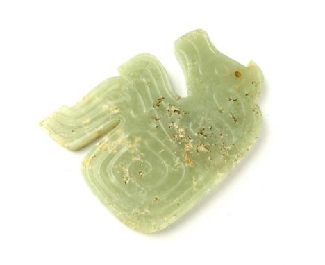 A Chinese Shang style celadon jade kneeling bear pendant, 6.5 x 5cm.