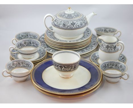 Wedgwood part dinner and tea service, pattern Black Florentine and two Spode dinner plates.