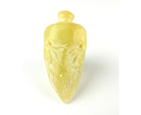 A Chinese white jade ''radish'' pendant, 5cm long.