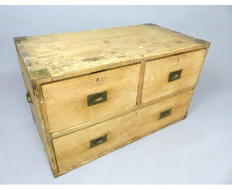 Campaign style pine trunk / table, brass corners and inset handles to the three drawers, later cup handles, 97 x 57cm h.