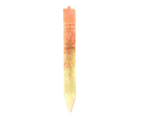 A Chinese carved green and red jade inverted ''obelisk'' form pendant, 15.5cm long.