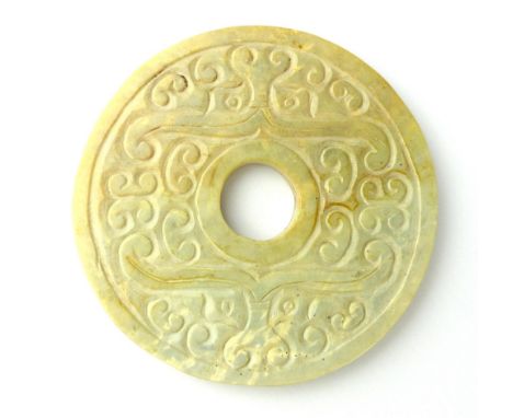 A Chinese ''white'' jade shallow carved Tao Tich pattern bi ring, 8cm dia.