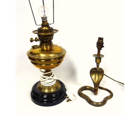 Edwardian brass oil lamp adapted to electricity, H.39cm, and an Indian brass serpent lamp, H.29cm. (2) 