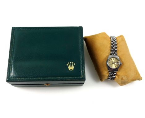 Lady's stainless steel Rolex Oyster Perpetual Datejust wrist watch with a champagne dial and silvered baton markers, date ape