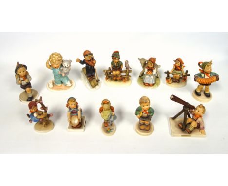 Hummel figures comprising a boy with telescope, H.11.5cm; girl skiing, (stick missing); and 13 other figures, (3 a/f), and a 