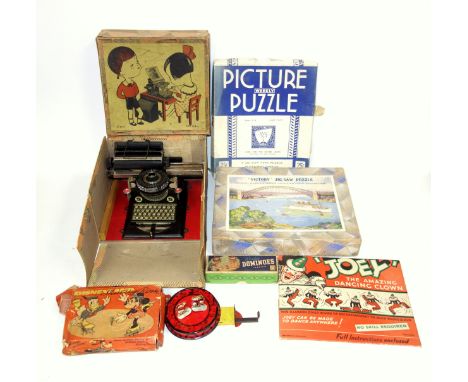 German D R P toy tinplate typewriter with revolving typeface, boxed, W.20.5cm; Disneyland skating rink with Donald Duck and M