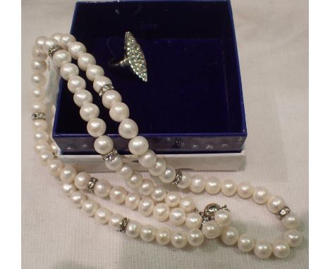 Single strand pearl necklace, L: 60 cm and a white metal diamante ring, size K (2). P&amp;P Group 1 (£14+VAT for the first lo