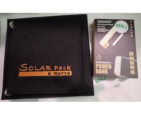 Six watt folding solar panel pack and cassette tape style power bank to recharge mobile phones and tablets etc. Working at ti