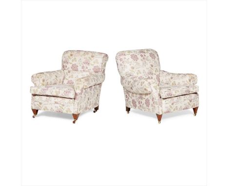 MATCHED PAIR OF EDWARDIAN UPHOLSTERED ARMCHAIRS EARLY 20TH CENTURY with padded low backs above a deep loose cushion seats and