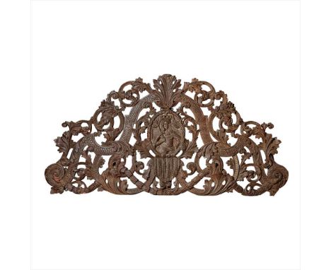 CHARLES II PARCEL-GILT AND SILVERED CARVED WALNUT DOORWAY PEDIMENT CIRCA 1670 the arched and pierced foliate carving with a c