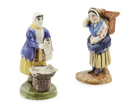 TWO PORTOBELLO POTTERY FIGURES OF FISHWIVES EARLY 19TH CENTURY both in traditional costume, the first carrying a basket of fi