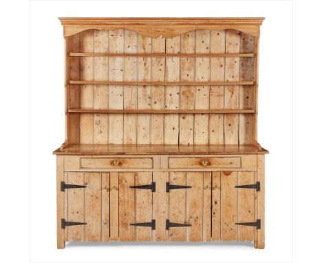 LARGE VICTORIAN PINE DRESSER LATE 19TH CENTURY the superstructure with a moulded cornice and shaped frieze over three open sh
