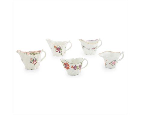 FIVE ENGLISH PORCELAIN 'CHELSEA LOW EWER' CREAMBOATS 18TH CENTURY all with moulded bodies and decorated with flowers in polyc