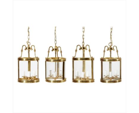 FOUR GEORGIAN STYLE LACQUERED BRASS HALL LANTERNS MODERN each of cylindrical form with three glass panels and a central three