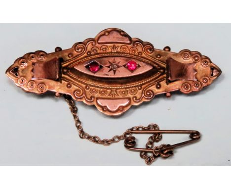 Victorian 9ct gold mourning brooch set with two small ruby stones, plus single clear stone. Total Weight Approx. 3.5g

Reason