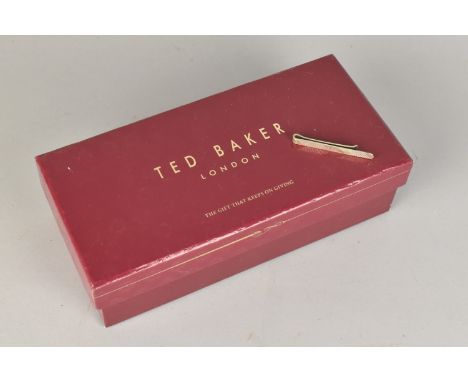 A Silver Tie Clip Together with a Ted Baker Box