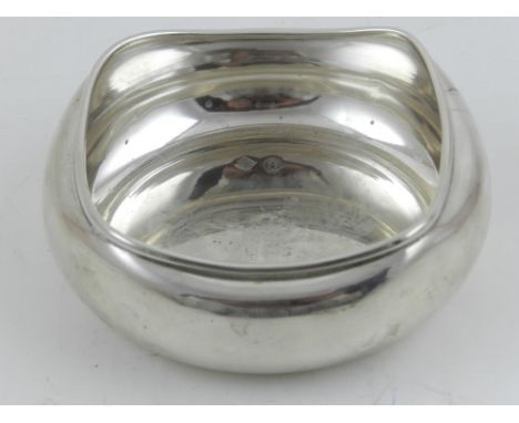 A white metal trinket bowl, having crimped rim, hallmarked with eagle and 900. D.9cm