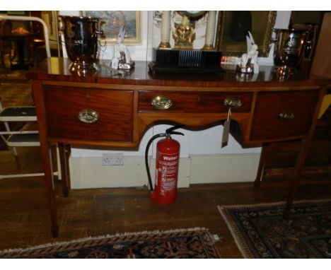 An Edwardian bow fronted sideboard, with central drawer flanked by one drawer and one cupboard door, raised on square tapered