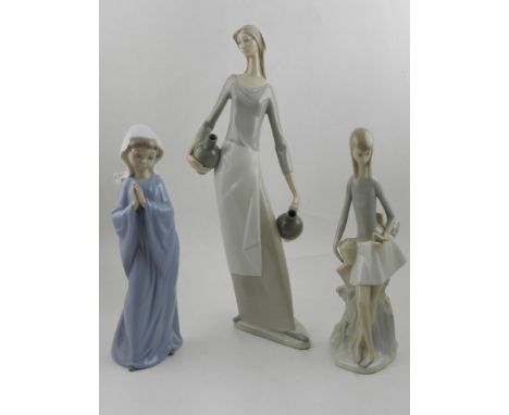 Three Nao porcelain figurines of ladies, tallest H.40cm