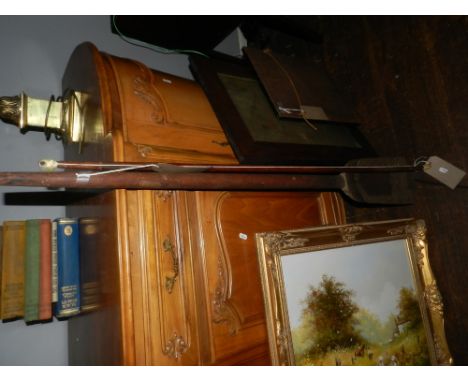 A long handled metal mounted shovel, together with a wooden bow. 