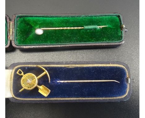 DIAMOND SET MINING LAPEL PINwith crossed pick and spade (Victorian registration mark to spade head), possibly on unmarked gol