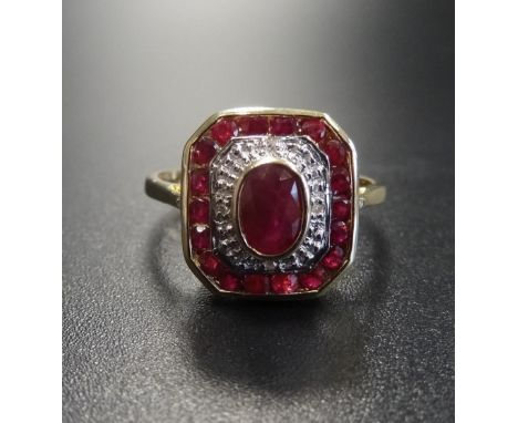 ART DECO STYLE RUBY AND DIAMOND RINGthe central oval cut ruby in diamond and ruby surround, on nine carat gold shank, ring si