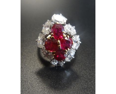 OUTSTANDING RUBY AND DIAMOND CLUSTER RINGthe central ruby cluster formed with four oval cut stones totalling approximately 2c