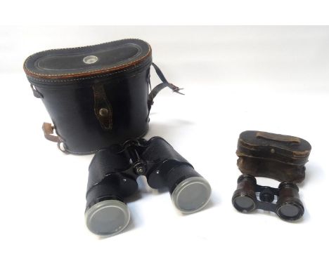 PAIR OF REGENT FIELD GLASSESwith 10 x 50 magnification, in a fitted leather case with a built in compass to the lid, together