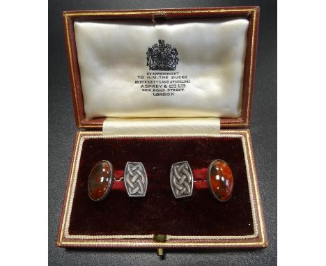 PAIR OF JOHN HART 'IONA' SILVER CUFFLINKSwith oval cabochon agates and Celtic knot decoration, in Asprey & Co. fitted box 