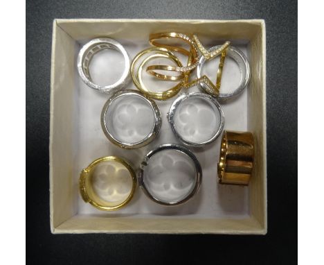 TEN DESIGNER RINGScomprising three Michael Kors logo panel rings, one silver tone, one yellow gold tone and one rose gold ton