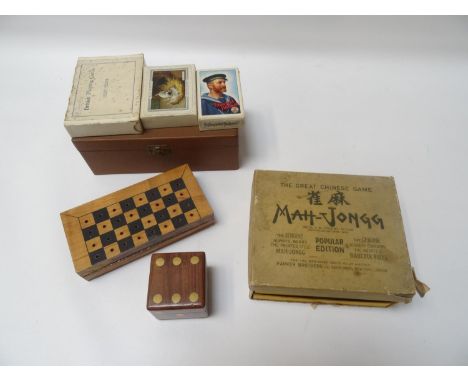 SELECTION OF GAMESincluding a boxed set of Mah-Jongg with instructions; a travelling chess set with pieces; a set of five Pok