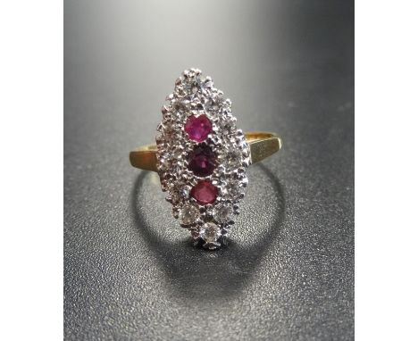 RUBY AND DIAMOND CLUSTER RING the three vertically set rubies in diamond surround, the diamonds totalling approximately 0.48c