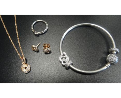SELECTION OF PANDORA JEWELLERYcomprising a Pandora Rose Sparkling Love Knot pendant on chain with matching earrings; a silver