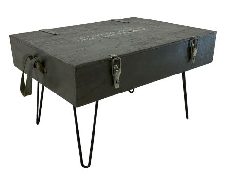 Ex-military green painted wooden coffee table, the hinged lid inscribed  'Case Lamp Filaments', on black painted loop feetDim