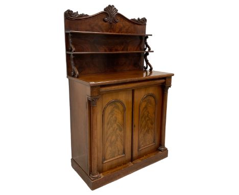 19th century mahogany chiffonier, the raised shaped back with scrolled foliate and central cartouche carved decoration, raise