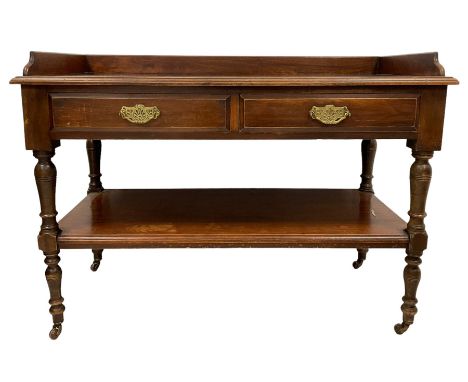 Late 19th century walnut washstand or buffet, the raised back on rectangular top with moulded edge, fitted with two drawers o