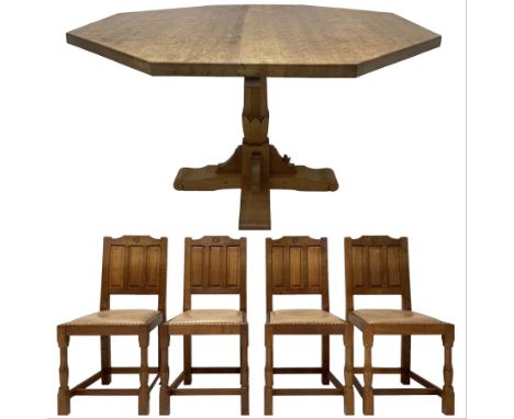 Wrenman - adzed oak dining table, octagonal top on carved pedestal base, cruciform sledge feet with scroll carved terminals, 